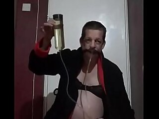 Bisexual crossdresser mark wright drinks his own piss threw a homemade pissing device and wants your piss aswell