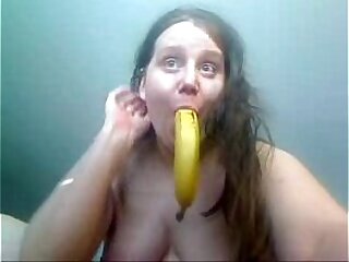 Amateur girl playing with banana
